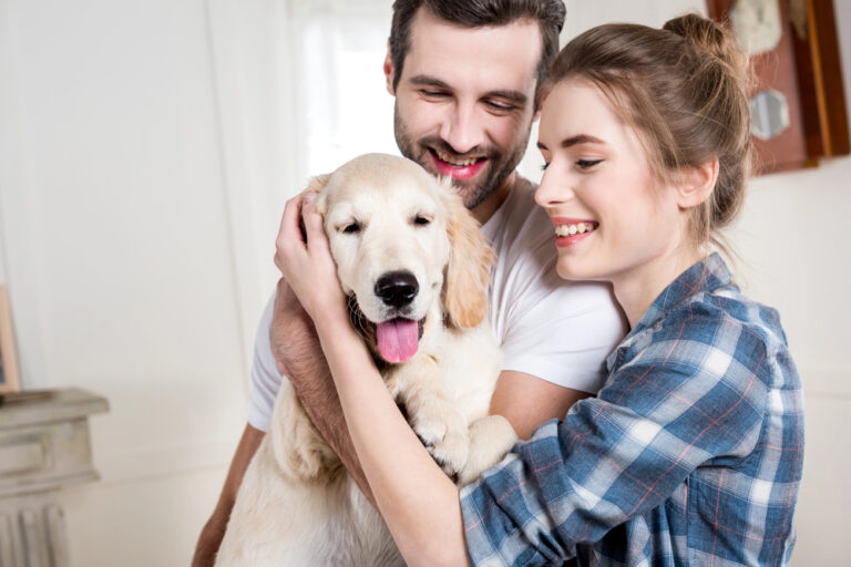 Young couple with puppy