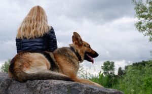 Woman hiking with GSD